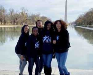 group of girls from Girls’ Empowerment Mission standing in front of the Washington Monument